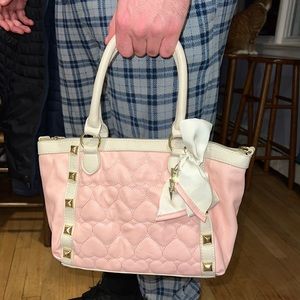 Pink Betsy Johnson purse with heart stitching